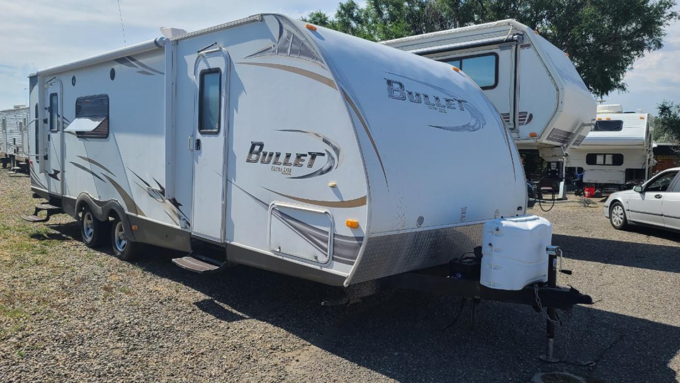 2011 White Keystone Bullrt , located at 923 US HWY 87 E., Billings, MT, 59101, (406) 245-0456, 45.795788, -108.451881 - 2011 Keystone Bullet ultralight, model 278RLS, 27 ft with one super slide, rear living room, two rear rockers, heated enclosed underbelly, front Queen walk around bed, u shaped dinette and jackknife couch both make into beds, could sleep eight, a/c, hot water, furnace, dry weight 4986 lb. John at 40 - Photo #1