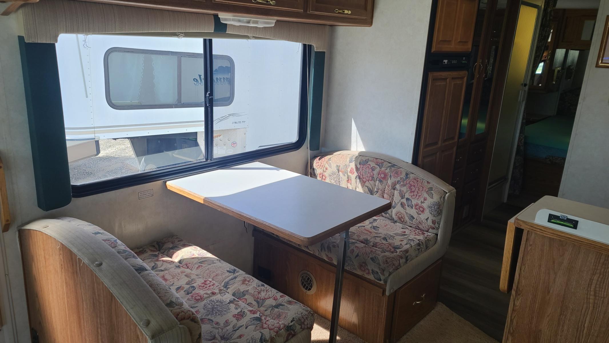 1999 White Thor Pinnacle , located at 923 US HWY 87 E., Billings, MT, 59101, (406) 245-0456, 45.795788, -108.451881 - Very nice 30 ft class A motorhome with only 63,000 mi and one slide. Booth dinette and jackknife couch both make into beds, backup camera, rear queen walk around bed, Ford Triton V10, could sleep 6, nice hall closet. John at 406-208-0659 - Photo #4