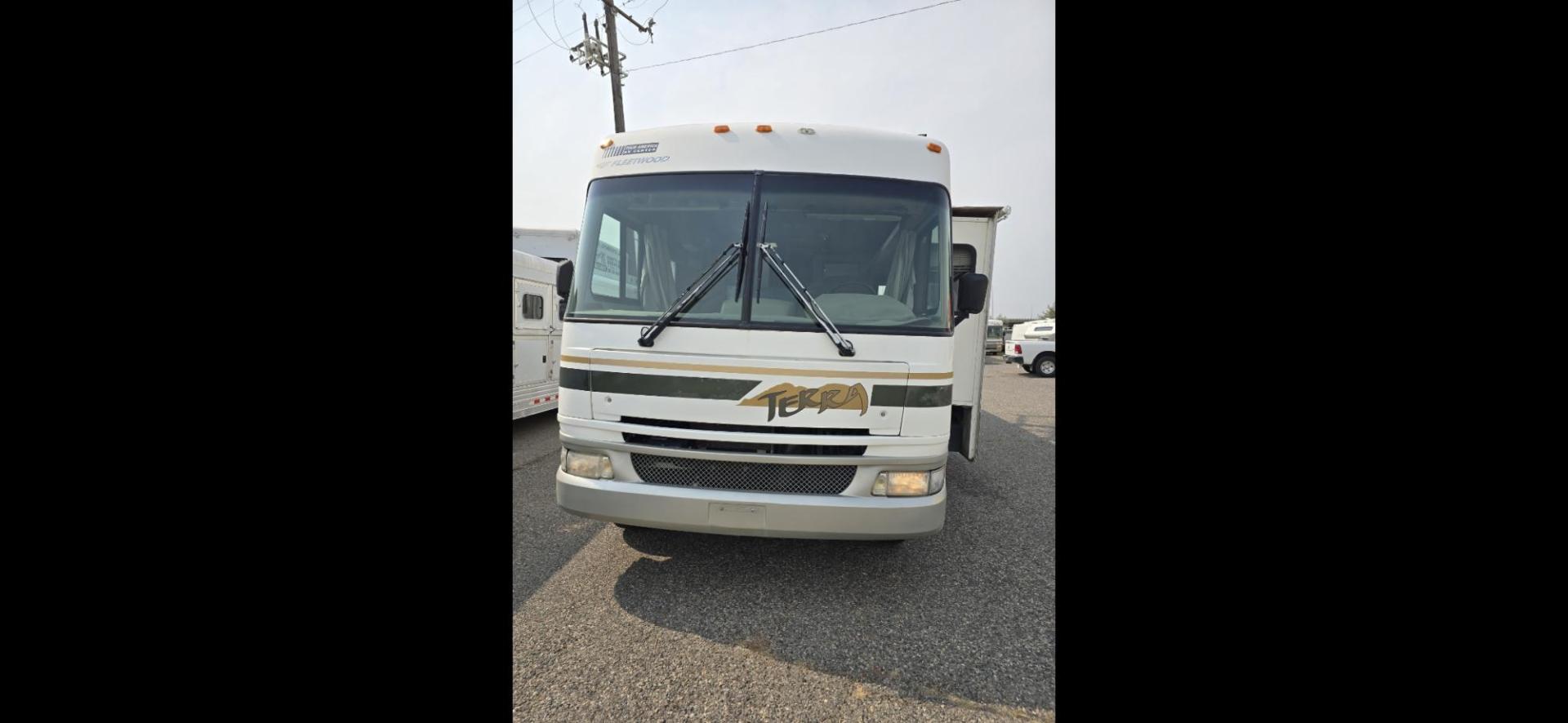 2005 White Fleetwood Terra , located at 923 US HWY 87 E., Billings, MT, 59101, (406) 245-0456, 45.795788, -108.451881 - 2005 Fleetwood Terra class A Motorhome with a Ford Triton V10 gas 32' with 1 slide. 74,018 miles, Couch and booth dinette both make into beds, Rear queen walk around bed, Could sleep 6, Onan 5500 generator, Leveling jacks, Dual A/C, Tires at 95%, Hot water, Furnace. WE CERTIFY OUR USED INVENTORY!!!! - Photo#1