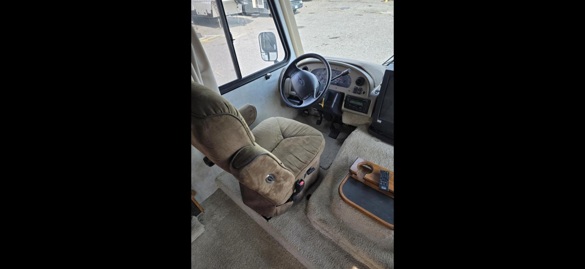 2005 White Fleetwood Terra , located at 923 US HWY 87 E., Billings, MT, 59101, (406) 245-0456, 45.795788, -108.451881 - 2005 Fleetwood Terra class A Motorhome with a Ford Triton V10 gas 32' with 1 slide. 74,018 miles, Couch and booth dinette both make into beds, Rear queen walk around bed, Could sleep 6, Onan 5500 generator, Leveling jacks, Dual A/C, Tires at 95%, Hot water, Furnace. WE CERTIFY OUR USED INVENTORY!!!! - Photo#7