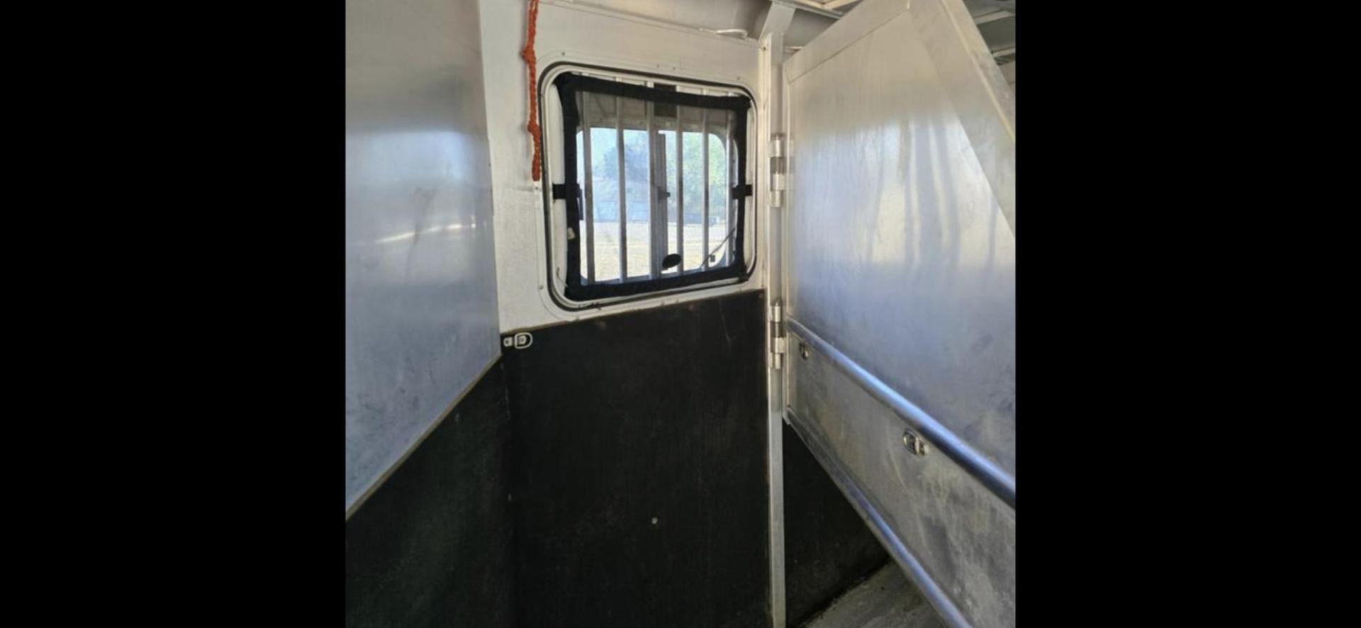 2003 White Sooner 3 Horse LQ , located at 923 US HWY 87 E., Billings, MT, 59101, (406) 245-0456, 45.795788, -108.451881 - Very nice three horse slant, 36' overall length, 7' short wall, Aluminum on aluminum, A/C, Forced air heat, Huge 6' midtack with sink, Rear three horse saddle rack, Tires at 80 percent, Front queen bed, couch makes into a bed, Full bath shower toilet, Light hail. John at 4062080659 - Photo#14