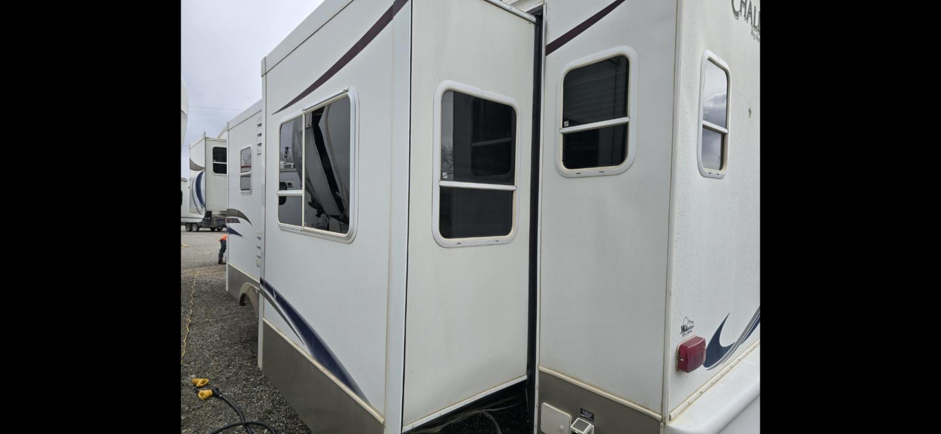 2006 White Keystone Challenger 34SAQ , located at 923 US HWY 87 E., Billings, MT, 59101, (406) 245-0456, 45.795788, -108.451881 - 2006 Keystone Challenger This is a gorgeous trailer. Located in Billings MT. 4 season Four slides, rear living room, front queen walk around bed, front designer closet, couch makes into a bed, could sleep four, washer and dryer hookups, a/c , hot water, furnace. WE CERTIFY OUR USED TRAILERS. Jo - Photo#2