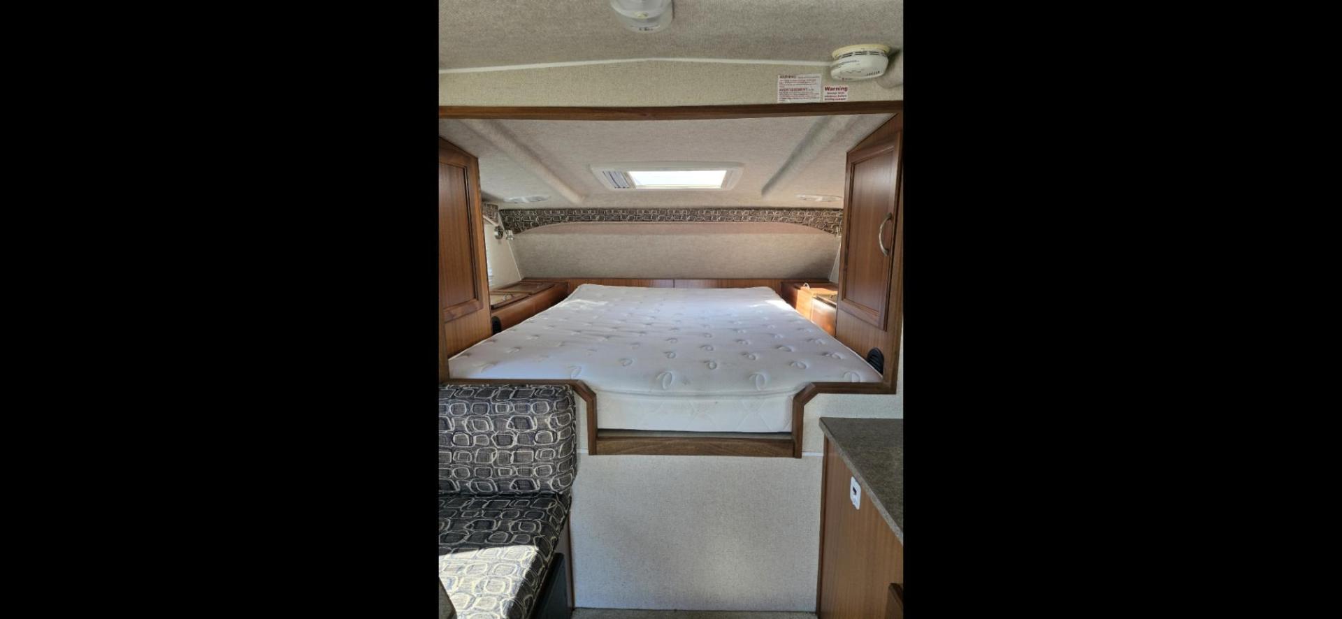 2020 White Northern Lite Sportsman , located at 923 US HWY 87 E., Billings, MT, 59101, (406) 245-0456, 45.795788, -108.451881 - 2020 Northern Lite Sportsman 8-11 Like brand new!!!! 2020 Northern Lite Sportsman slide in. 7'1" long floor, model.8-11, for a short box, 2 piece fiberglass., lightweight, wet bath, full bath shower toilet,front queen bed, dinette makes into bed, could sleep 4, microwave, auto jacks, four season - Photo#6