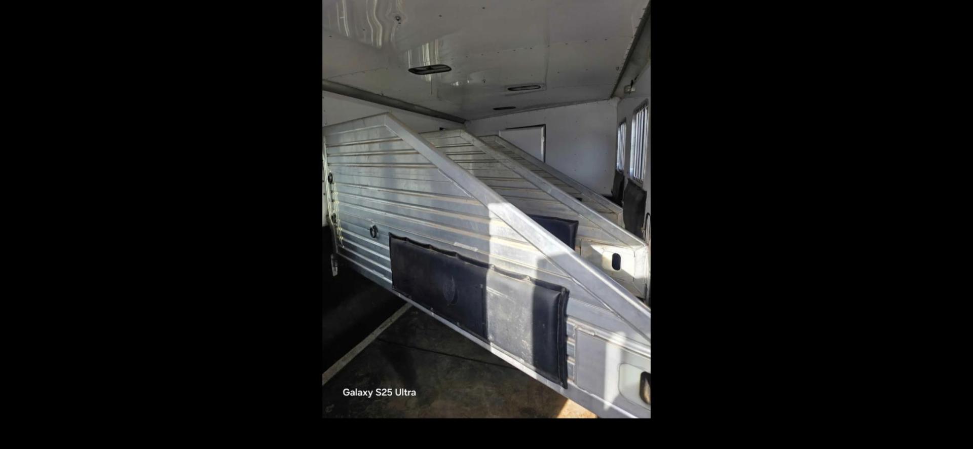 2003 White Feather Lite 4 Horse , located at 923 US HWY 87 E., Billings, MT, 59101, (406) 245-0456, 45.795788, -108.451881 - 2003 Feather Lite 4Horse LQ Located in Billings $33,900 2003 FeatherLite 4 horse 8 wide... huge mid tack... Slide... Onan 7k Generator w auto remote start... hay rack... 14ply 2020 tires 90%... dual auto front jacks... aluminum on aluminum.... no mangers w collapsible rear tack... rear ramp - Photo#15