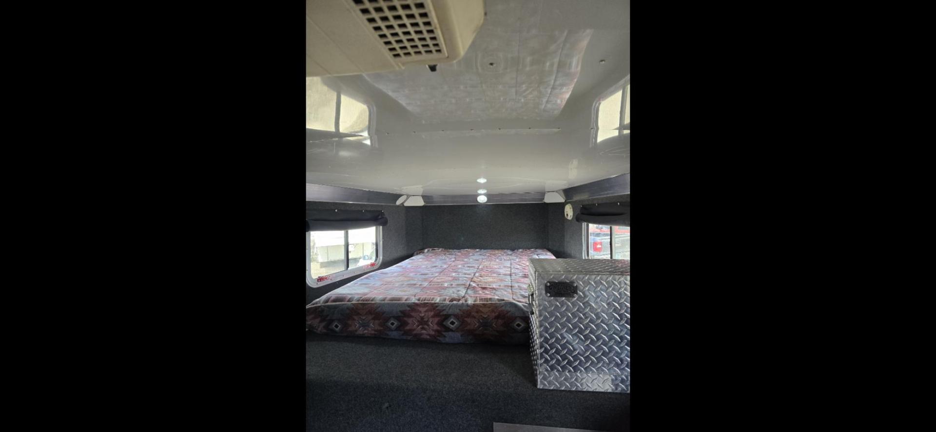 2011 Black 4 Star Stock , located at 923 US HWY 87 E., Billings, MT, 59101, (406) 245-0456, 45.795788, -108.451881 - 2011 Four Star stock trailer Located in Billings MT $35,900 Overall length 36'8", floor 28'8", short wall 6' 8", 6' 7" interior height in stock area. 8' wide. Rear stock with full l q, bath shower toilet, A/C, heat hot water. Aluminum on aluminum. Front queen bed. WE CERTIFY OUR USED TRAILERS! - Photo#5