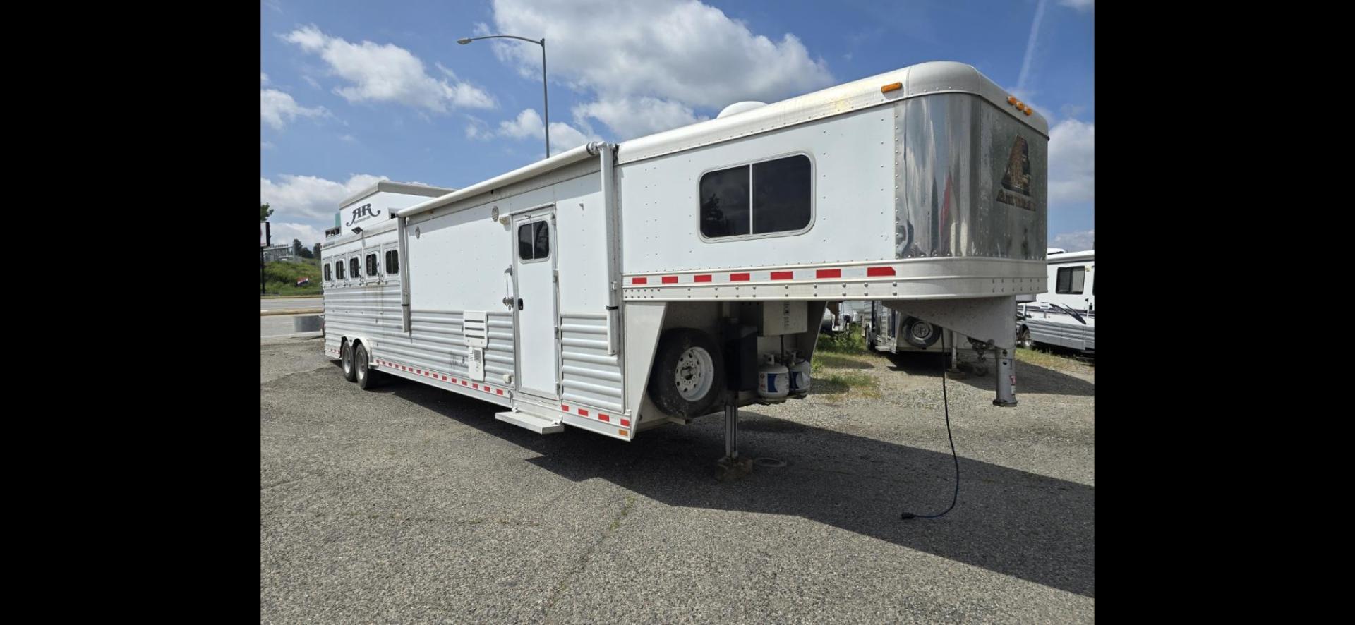 2014 Elite 5 Horse LQ , located at 923 US HWY 87 E., Billings, MT, 59101, (406) 245-0456, 45.795788, -108.451881 - 2014 Elite 5 Horse LQ Billings MT $85,900 This is such a nice trailer!!! OUTLAW conversion package. 5 horse with a 16' short wall. Generator, hay pod, satellite dish, rear tack, aluminum on aluminum, fold down windows front and back, studwall, auto awning. 8' wide, 41' overall, floor length 3 - Photo#0