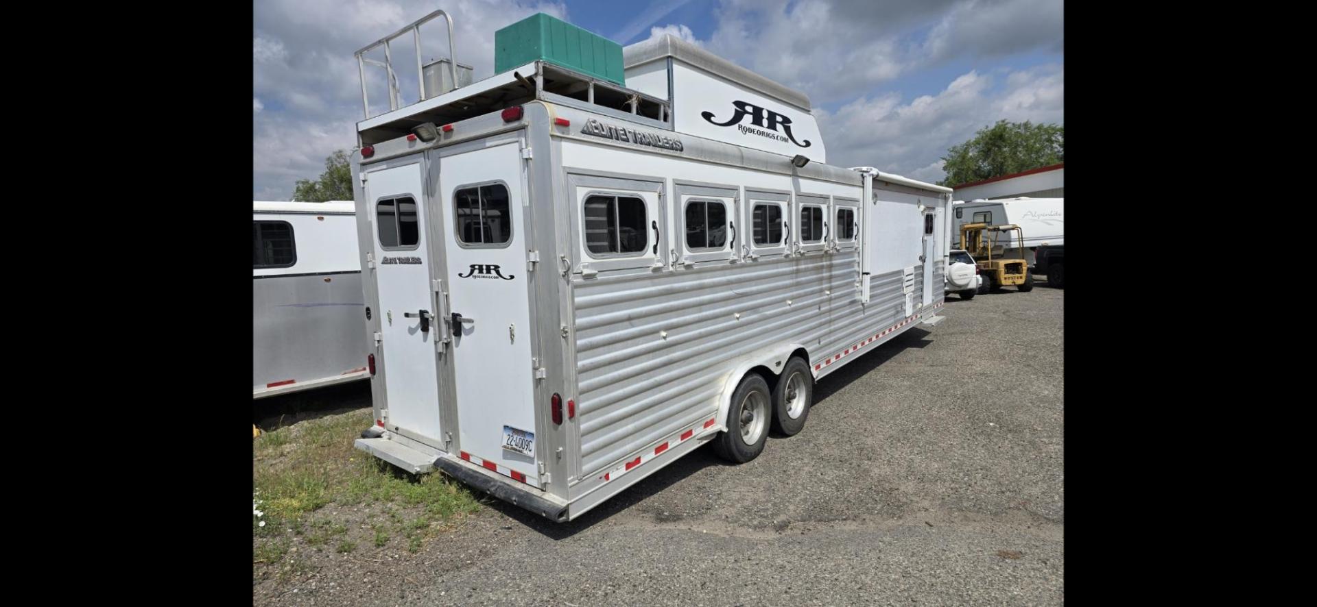 2014 Elite 5 Horse LQ , located at 923 US HWY 87 E., Billings, MT, 59101, (406) 245-0456, 45.795788, -108.451881 - 2014 Elite 5 Horse LQ Billings MT $85,900 This is such a nice trailer!!! OUTLAW conversion package. 5 horse with a 16' short wall. Generator, hay pod, satellite dish, rear tack, aluminum on aluminum, fold down windows front and back, studwall, auto awning. 8' wide, 41' overall, floor length 3 - Photo#1