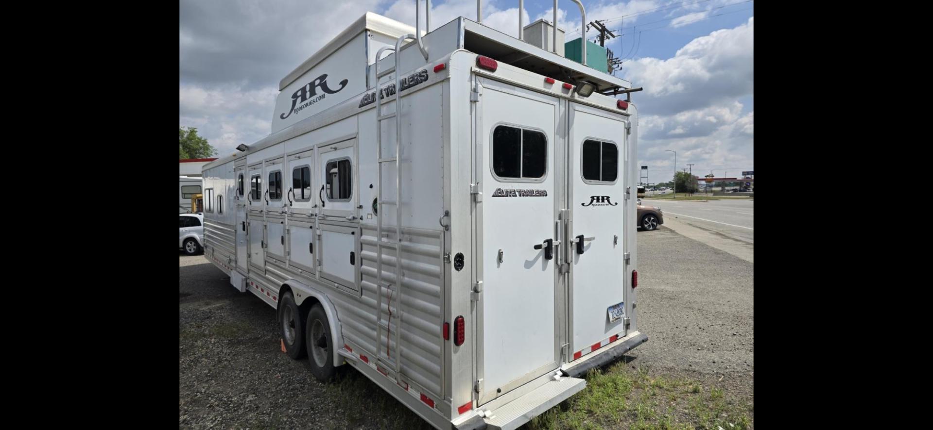 2014 Elite 5 Horse LQ , located at 923 US HWY 87 E., Billings, MT, 59101, (406) 245-0456, 45.795788, -108.451881 - 2014 Elite 5 Horse LQ Billings MT $85,900 This is such a nice trailer!!! OUTLAW conversion package. 5 horse with a 16' short wall. Generator, hay pod, satellite dish, rear tack, aluminum on aluminum, fold down windows front and back, studwall, auto awning. 8' wide, 41' overall, floor length 3 - Photo#2