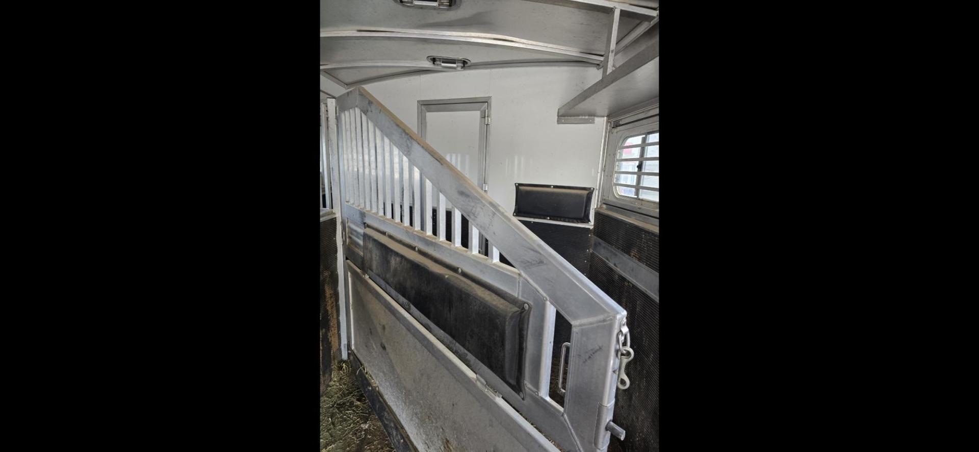 2014 Elite 5 Horse LQ , located at 923 US HWY 87 E., Billings, MT, 59101, (406) 245-0456, 45.795788, -108.451881 - 2014 Elite 5 Horse LQ Billings MT $85,900 This is such a nice trailer!!! OUTLAW conversion package. 5 horse with a 16' short wall. Generator, hay pod, satellite dish, rear tack, aluminum on aluminum, fold down windows front and back, studwall, auto awning. 8' wide, 41' overall, floor length 3 - Photo#7