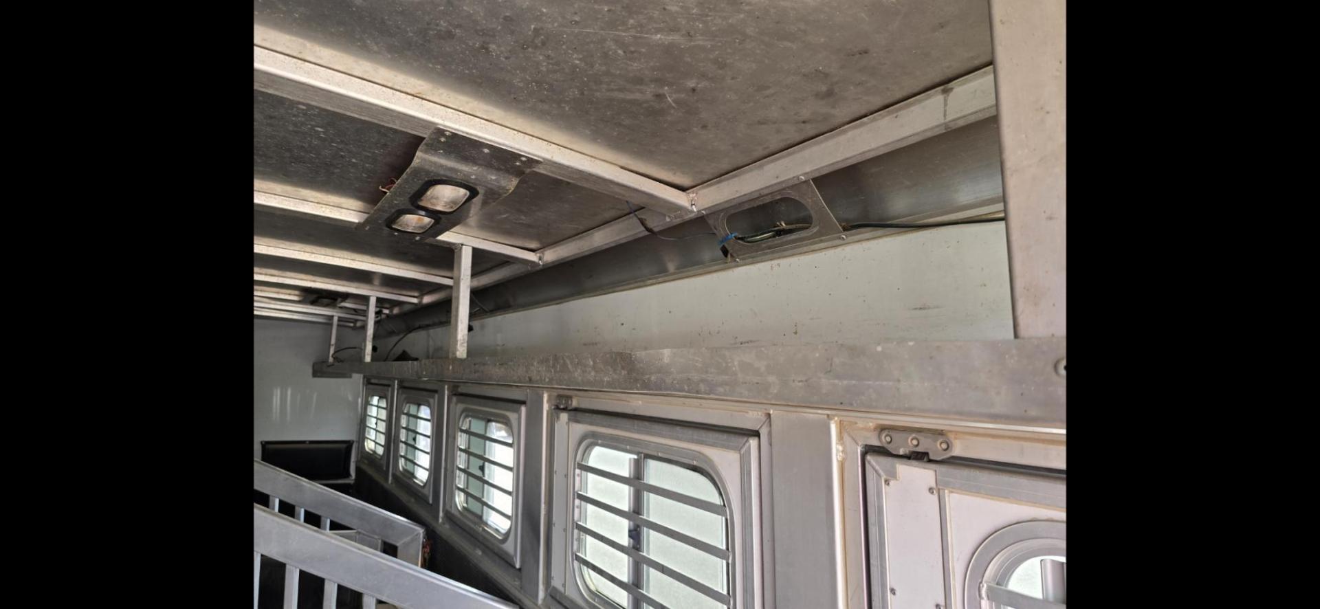 2014 Elite 5 Horse LQ , located at 923 US HWY 87 E., Billings, MT, 59101, (406) 245-0456, 45.795788, -108.451881 - 2014 Elite 5 Horse LQ Billings MT $85,900 This is such a nice trailer!!! OUTLAW conversion package. 5 horse with a 16' short wall. Generator, hay pod, satellite dish, rear tack, aluminum on aluminum, fold down windows front and back, studwall, auto awning. 8' wide, 41' overall, floor length 3 - Photo#6