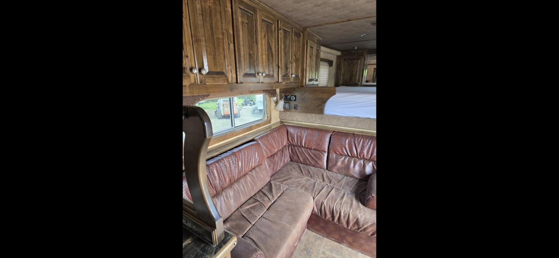 2014 Elite 5 Horse LQ , located at 923 US HWY 87 E., Billings, MT, 59101, (406) 245-0456, 45.795788, -108.451881 - 2014 Elite 5 Horse LQ Billings MT $85,900 This is such a nice trailer!!! OUTLAW conversion package. 5 horse with a 16' short wall. Generator, hay pod, satellite dish, rear tack, aluminum on aluminum, fold down windows front and back, studwall, auto awning. 8' wide, 41' overall, floor length 3 - Photo#9
