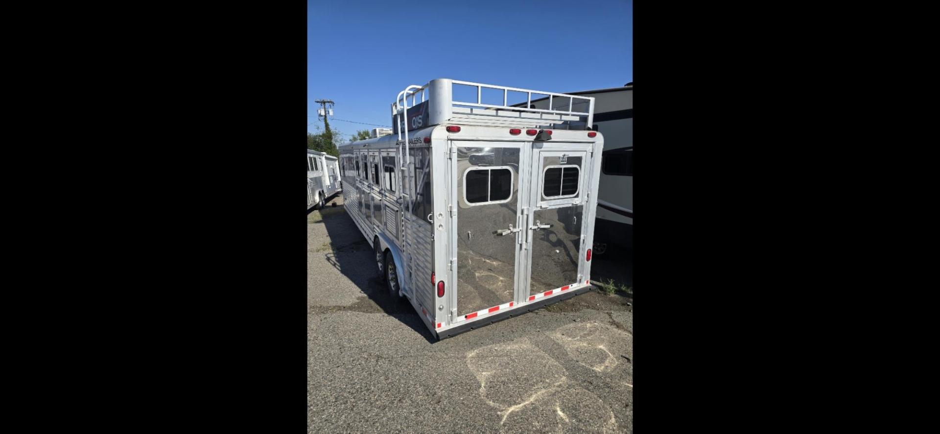 2004 Silver Elite 4 Horse LQ , located at 923 US HWY 87 E., Billings, MT, 59101, (406) 245-0456, 45.795788, -108.451881 - 2004 Elite 4 Horse LQ 2004 Elite 4 Horse w/LQ Located in Billings MT $35,900 This is a really nice trailer!! 4 Horse with 12' living quarters. Aluminum on aluminum, 4 Spot saddle rack, onan 5500 generator, hay rack, stud wall, Mangers w/ storage underneath, full bath shower toilet, a/c hot w - Photo#2