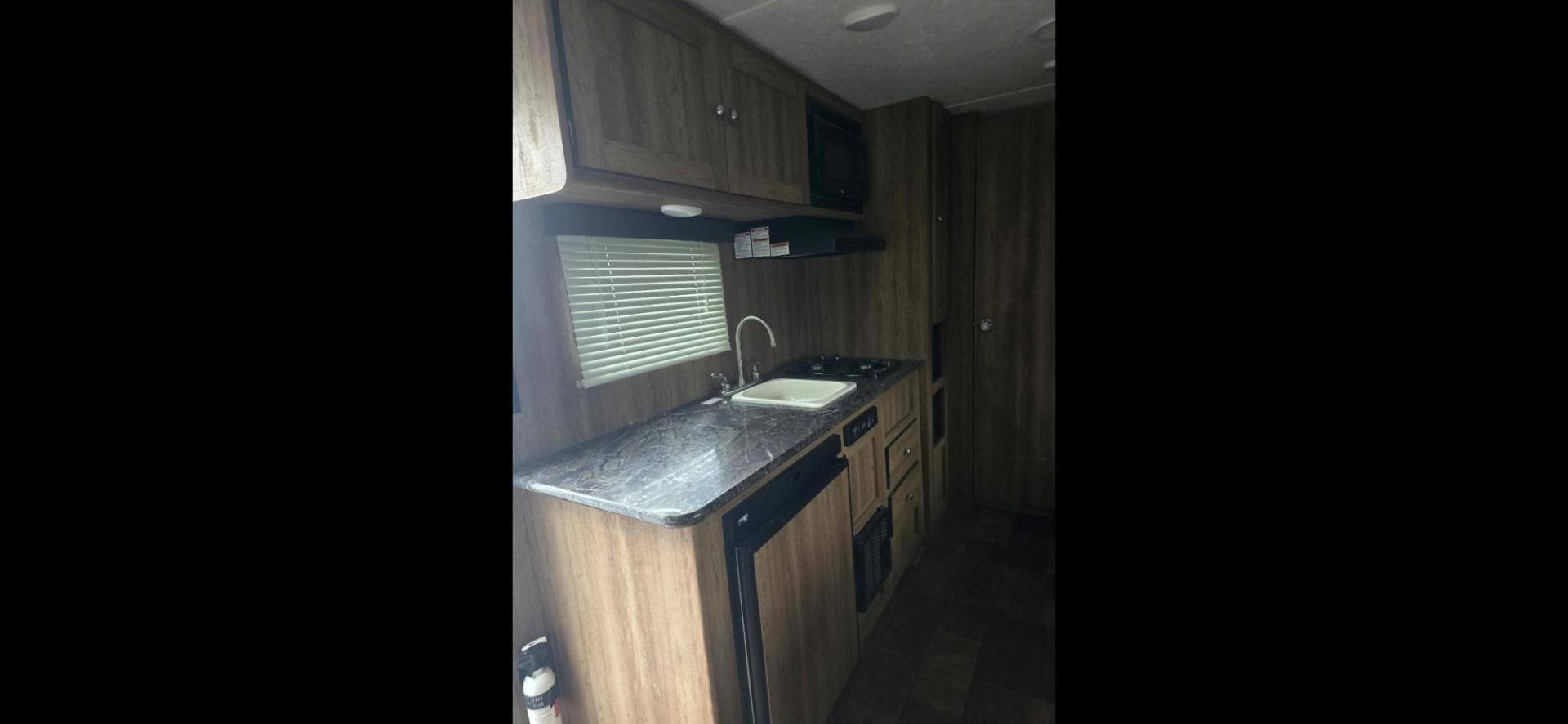 2017 Grey Keystone Springdale Fireside , located at 923 US HWY 87 E., Billings, MT, 59101, (406) 245-0456, 45.795788, -108.451881 - 2017 Keystone Sprinter READY TO HUNT 20017 Springdale 1800BH travel trailer. Half ton towable.Dry weight 3195 lbs. Front queen bed, rear double bunks, dinette makes into a bed. Could sleep six. Full bath, shower toilet, outside stereo, a/c, hot water, furnace. Light hail. WE CERTIFY OUR USED TR - Photo#6