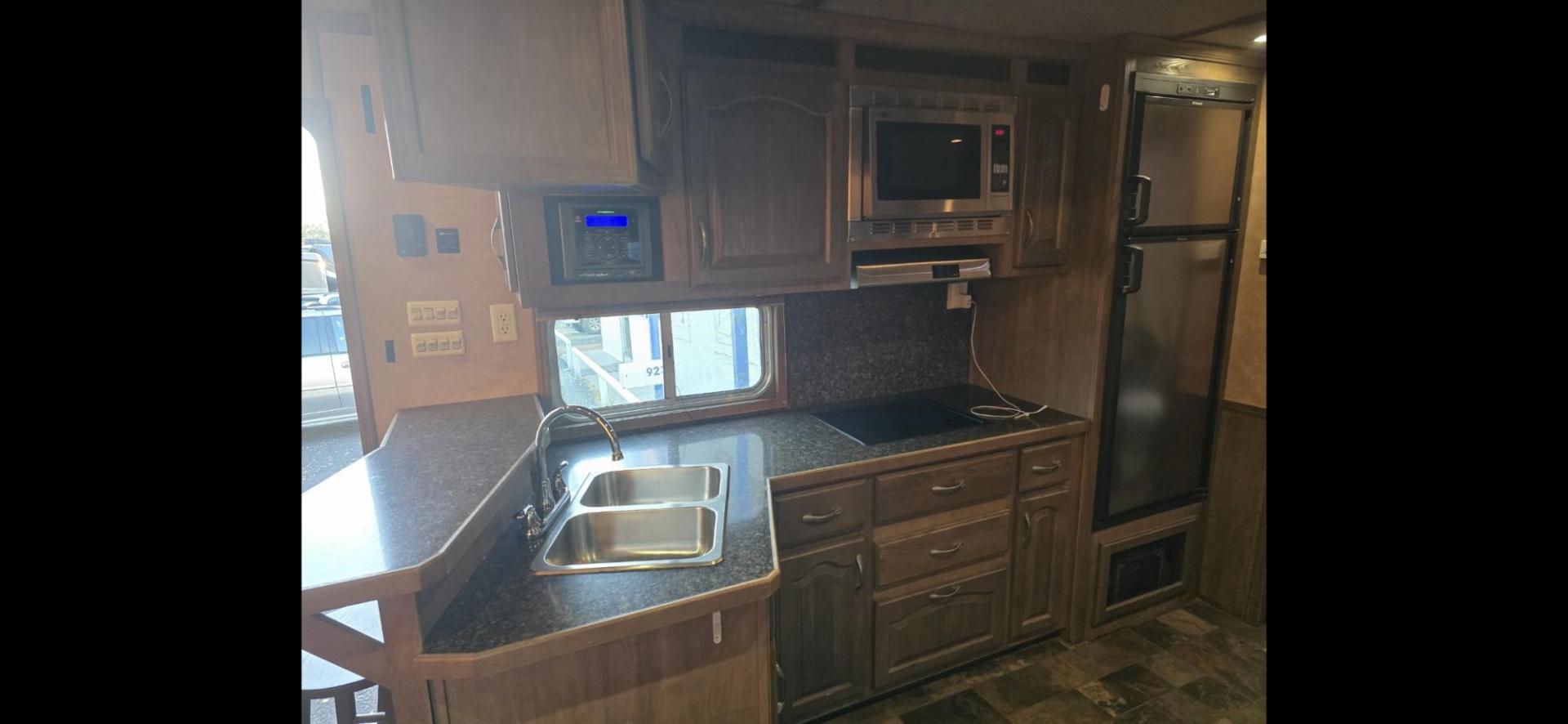 2011 White Lakota Big Horn , located at 923 US HWY 87 E., Billings, MT, 59101, (406) 245-0456, 45.795788, -108.451881 - 2011 Lakota Big Horn 8416 2011 Lakota Big Horn 4 Horse slant with super slide Located in Billings MT $55,900 This is such a nice trailer!!! 42' overall, empty weight 11,475 lbs, 8' wide, 16' LQ. Super slide, front Queen bed, Jackknife couch and booth dinette both make into beds. Could - Photo#15