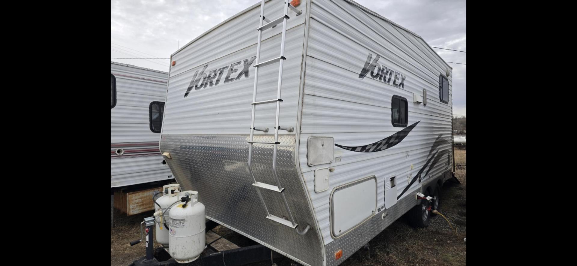 2007 White Thor Vortex , located at 923 US HWY 87 E., Billings, MT, 59101, (406) 245-0456, 45.795788, -108.451881 - Nice 2007 Thor Vortex 1/2 ton towable toy hauler with 15 gallon fuel station. Garage is 15' long. 9' is 8' wide and 6' is 6'4" wide. Lots of sleeping space. Double auto queen beds in ceiling, booth and couch both fold into beds. A/C, forced air heat, hot water, dual thirty pound propane tanks. Mode - Photo#0