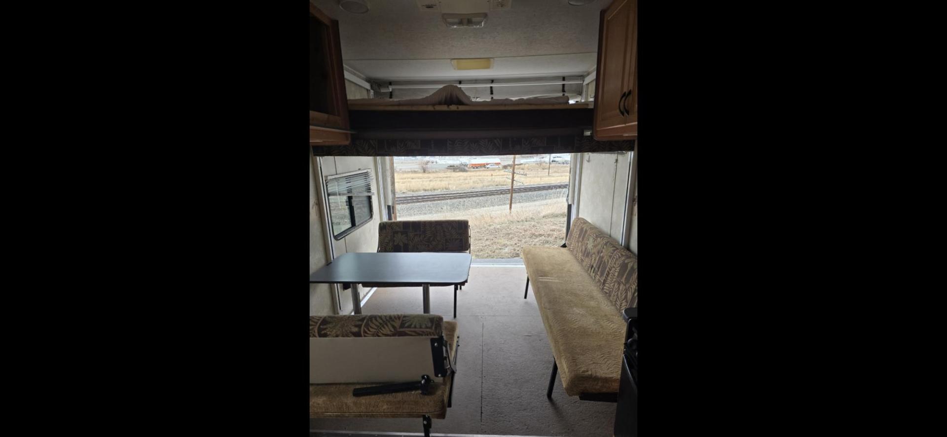 2007 White Thor Vortex , located at 923 US HWY 87 E., Billings, MT, 59101, (406) 245-0456, 45.795788, -108.451881 - Nice 2007 Thor Vortex 1/2 ton towable toy hauler with 15 gallon fuel station. Garage is 15' long. 9' is 8' wide and 6' is 6'4" wide. Lots of sleeping space. Double auto queen beds in ceiling, booth and couch both fold into beds. A/C, forced air heat, hot water, dual thirty pound propane tanks. Mode - Photo#4