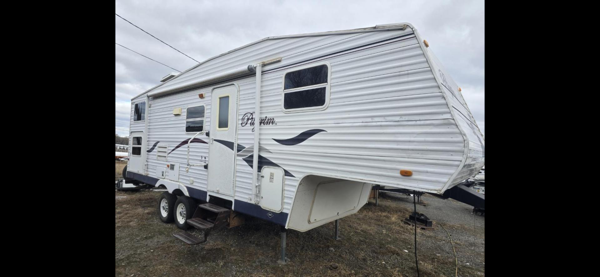 2006 White Pilgrim 5th wheel , located at 923 US HWY 87 E., Billings, MT, 59101, (406) 245-0456, 45.795788, -108.451881 - This is a very nice 1/2 ton towable 27' fifth wheel with a full super slide. Front queen walk around bed and rear double bunks. Couch and booth dynette both make into beds, could sleep 8. flipped axles for clearance, a/c, forced air heat, hot water, inside/outside showers, full bath shower toilet a - Photo#0