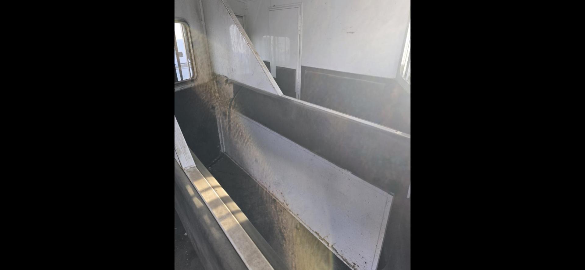 2014 White Bison Trailers Hand 380TH , located at 923 US HWY 87 E., Billings, MT, 59101, (406) 245-0456, 45.795788, -108.451881 - 2014 Bison Trail Hand 3 Horse Located in Billings MT $24,500 3 horse slant, 380TH, aluminum on aluminum, 7' Wide, hay rack, stud wall, full living quarters, bath, shower, toilet, a/c, hot water, furnace. Front queen bed and and jackknife couch makes into bed. Rear tack is collapsible. Front fold - Photo#4