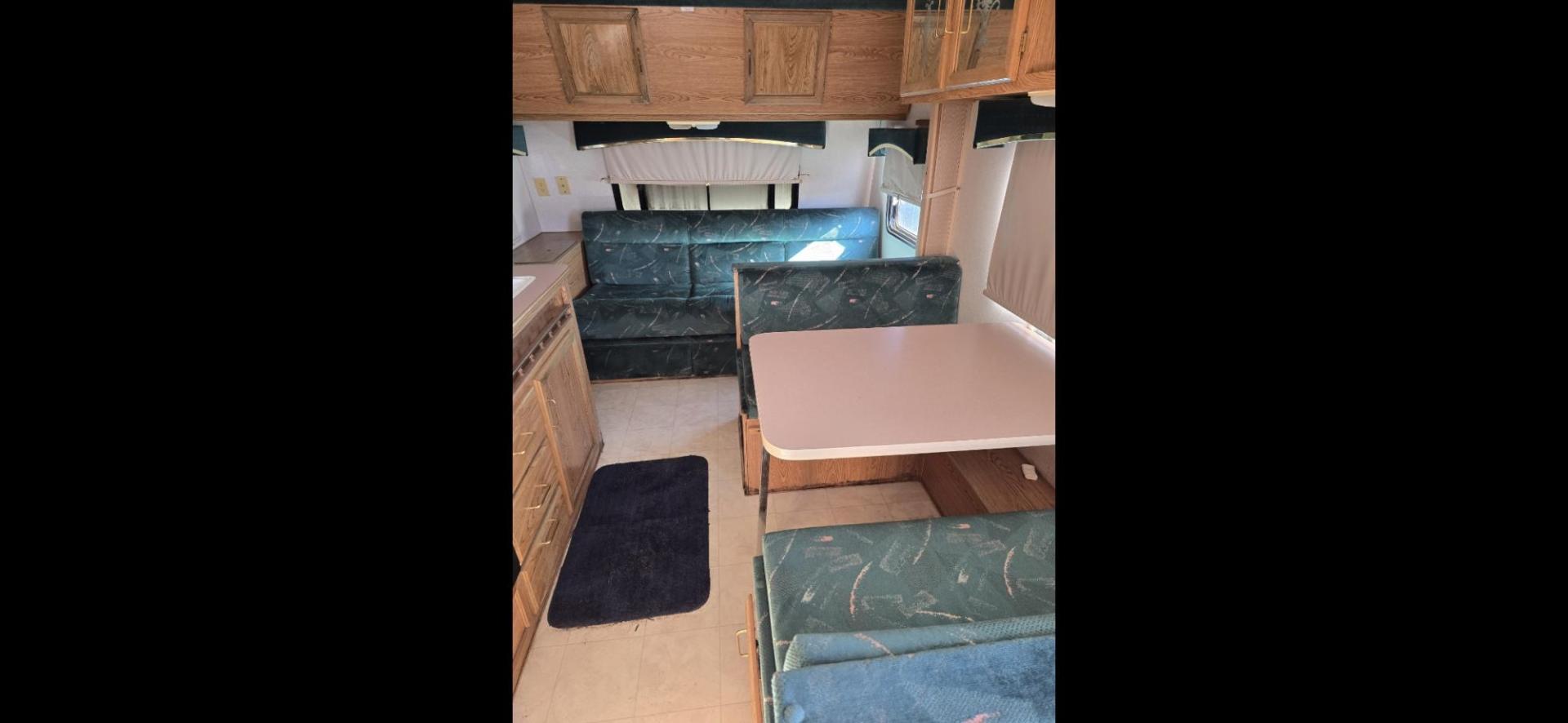 1993 White Fleetwood Wilderness , located at 923 US HWY 87 E., Billings, MT, 59101, (406) 245-0456, 45.795788, -108.451881 - 1993 Fleetwood Wilderness CAMPING ON A BUDGET!!! 19' travel trailer that is 1/2 ton towable. Booth dinette and Jack knife couch both make into beds. Full bath, shower toilet, AC, furnace. Nice sized refrigerator, front viewing window, 6 gal hot water heater. WE CERTIFY OUR USED TRAILERS!!! John - Photo#4