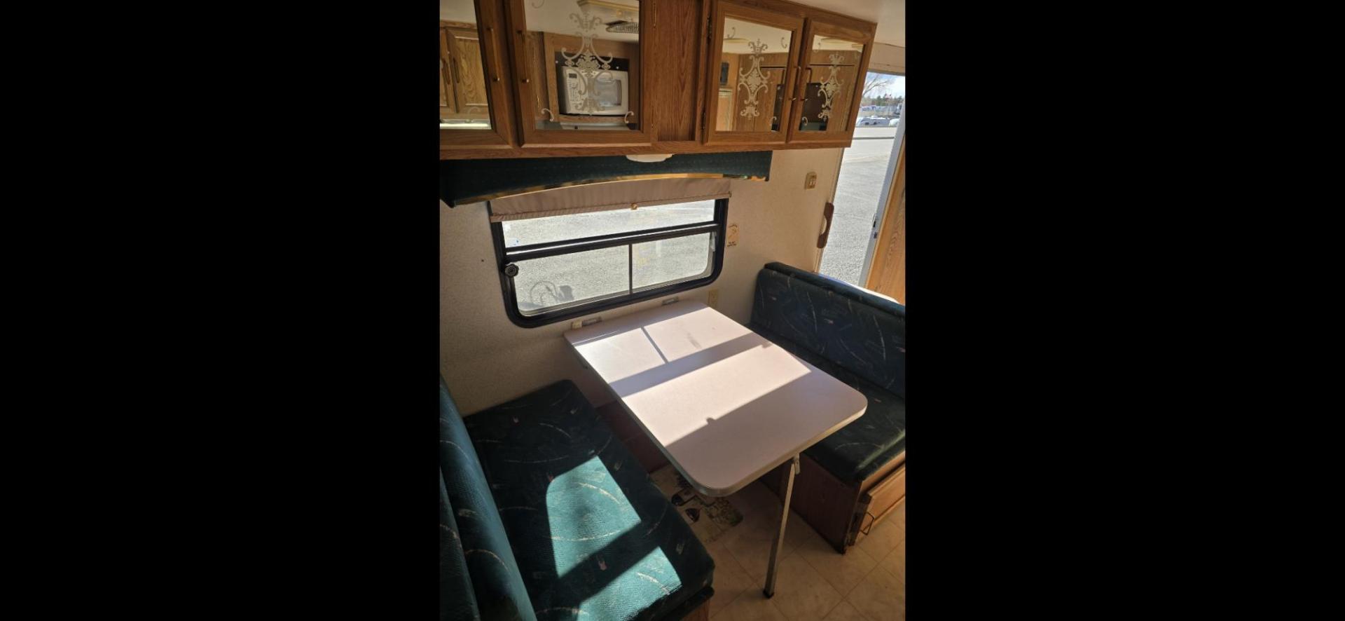 1993 White Fleetwood Wilderness , located at 923 US HWY 87 E., Billings, MT, 59101, (406) 245-0456, 45.795788, -108.451881 - 1993 Fleetwood Wilderness CAMPING ON A BUDGET!!! 19' travel trailer that is 1/2 ton towable. Booth dinette and Jack knife couch both make into beds. Full bath, shower toilet, AC, furnace. Nice sized refrigerator, front viewing window, 6 gal hot water heater. WE CERTIFY OUR USED TRAILERS!!! John - Photo#6