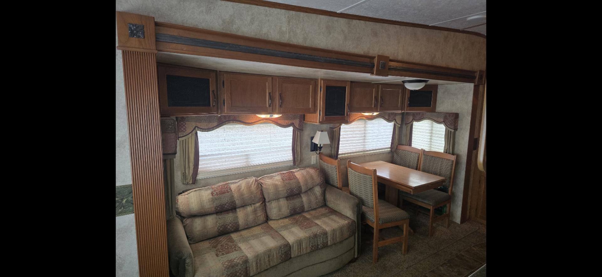 2010 White Keystone MT Mountaineer , located at 923 US HWY 87 E., Billings, MT, 59101, (406) 245-0456, 45.795788, -108.451881 - 2010 Keystone Montana Montaineer Located in Billings MT $12,500 This is an absolutely gorgeous 5th wheel trailer. 31' long, 2 slides, rear living room with two chairs, front queen walk around bed, Designer closet, couch makes into a bed, could sleep 4. Auto front and rear jacks, 4 season, he - Photo#4