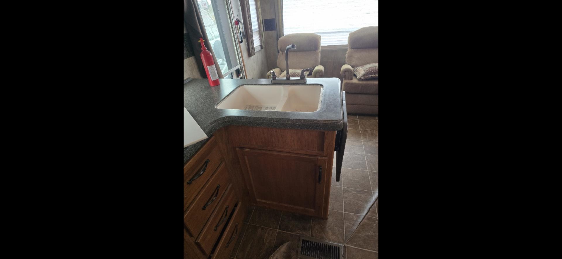 2010 White Keystone MT Mountaineer , located at 923 US HWY 87 E., Billings, MT, 59101, (406) 245-0456, 45.795788, -108.451881 - 2010 Keystone Montana Montaineer Located in Billings MT $12,500 This is an absolutely gorgeous 5th wheel trailer. 31' long, 2 slides, rear living room with two chairs, front queen walk around bed, Designer closet, couch makes into a bed, could sleep 4. Auto front and rear jacks, 4 season, he - Photo#7