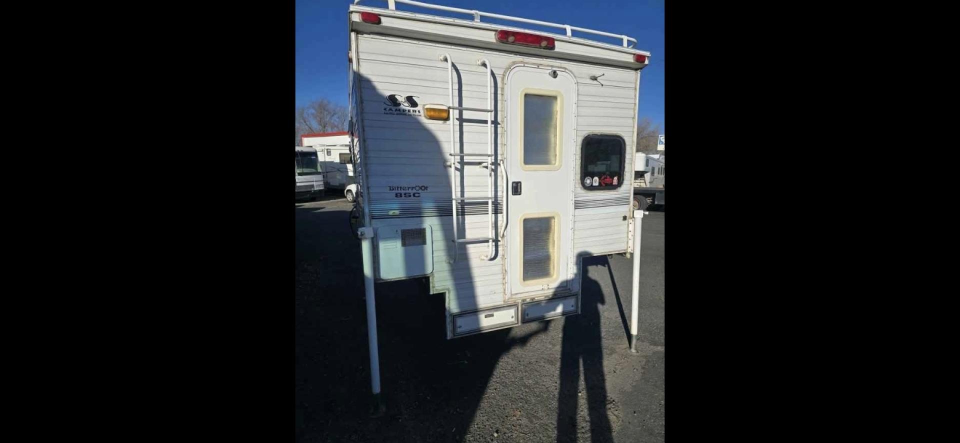 2003 White S&S Bitterroot 85C , located at 923 US HWY 87 E., Billings, MT, 59101, (406) 245-0456, 45.795788, -108.451881 - 2003 S&S Bitterroot 85C 8' Slide In 8' Slide In trailer with full bath-shower toilet, 6 gallon hot water heater, forced air heat, manual jacks, comes with full set of turn buckles, upper bunk, front queen bed, booth folds into bed. Full fridge/freezer that is 12V or propane. Dry weight 2500 LBS - Photo#2