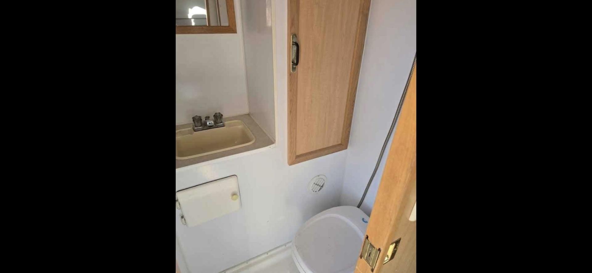 2003 White S&S Bitterroot 85C , located at 923 US HWY 87 E., Billings, MT, 59101, (406) 245-0456, 45.795788, -108.451881 - 2003 S&S Bitterroot 85C 8' Slide In 8' Slide In trailer with full bath-shower toilet, 6 gallon hot water heater, forced air heat, manual jacks, comes with full set of turn buckles, upper bunk, front queen bed, booth folds into bed. Full fridge/freezer that is 12V or propane. Dry weight 2500 LBS - Photo#7