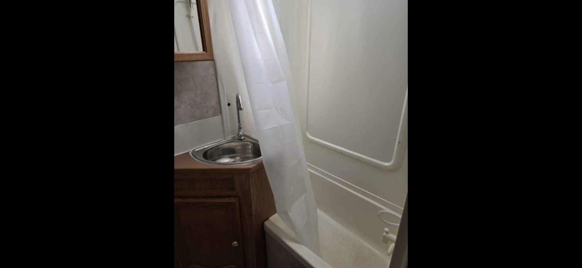 2006 White Keystone Springdale , located at 923 US HWY 87 E., Billings, MT, 59101, (406) 245-0456, 45.795788, -108.451881 - 2006 Keystone Springdale Adventure RV in Billings MT $7995 Very nice and clean 25' Springdale with a large super slide, front queen walk around bed, rear bunks that are 29" wide and 6'4" long, full awning, rear hitch, a/c, hot water, furnace. Booth dinette makes into a bed. Could sleep 6. Model - Photo#7