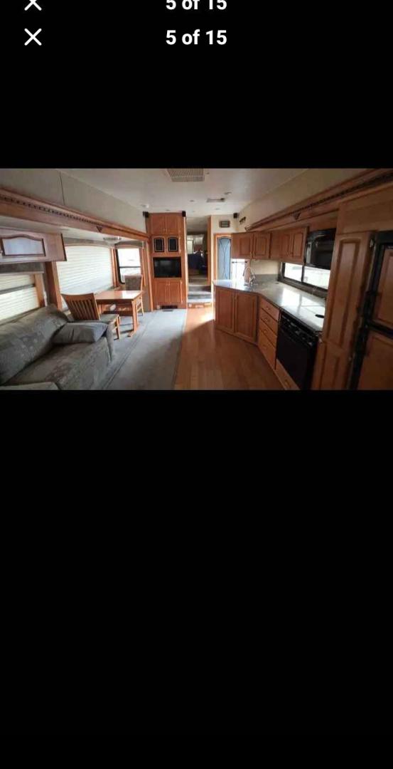 2007 White Western Alpen Lite , located at 923 US HWY 87 E., Billings, MT, 59101, (406) 245-0456, 45.795788, -108.451881 - 2007 Western Rv Alpenlite PERFECT TRAILER FOR A COUPLE!!! 3 slides solid surface countertops, spacious kitchen area, glass enclosed, shower, cold weather package, solar package, slide out cart in underbelly. Front queen bed and couch makes into bed. Could sleep 4. WE CERTIFY OUR USED TRAILERS!!!J- Photo#4